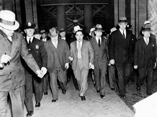 Salvatore Lucania, called Lucky Luciano, leaving court in New York on June 18, 1936