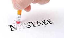 A pencil eraser rubbing out the word â€œMistakeâ€